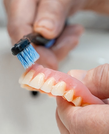 Cleaning Dentures with a Toothbrush